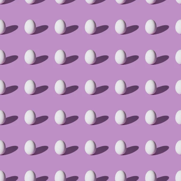 Set of chicken eggs on purple background — Stock Photo