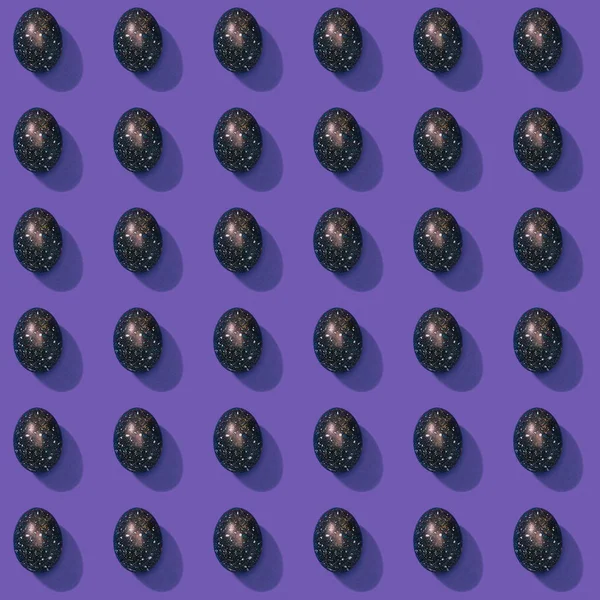 Collection of painted easter eggs on purple — Stock Photo