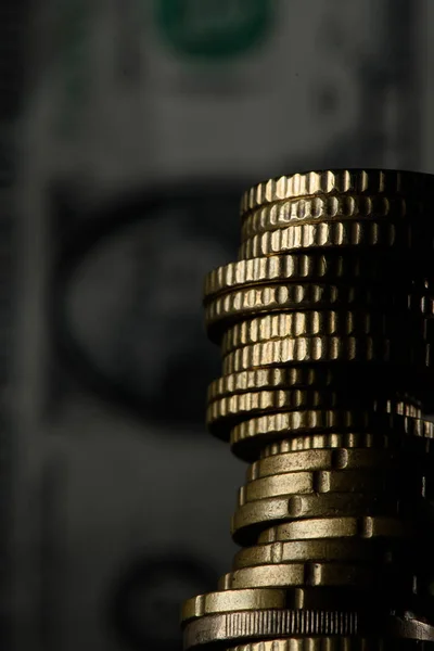 Selective focus of stack of coins and banknotes isolated on black — Stock Photo