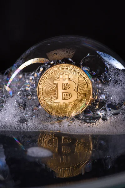 Close up view of golden bitcoin in soap bubble isolated on black — Stock Photo