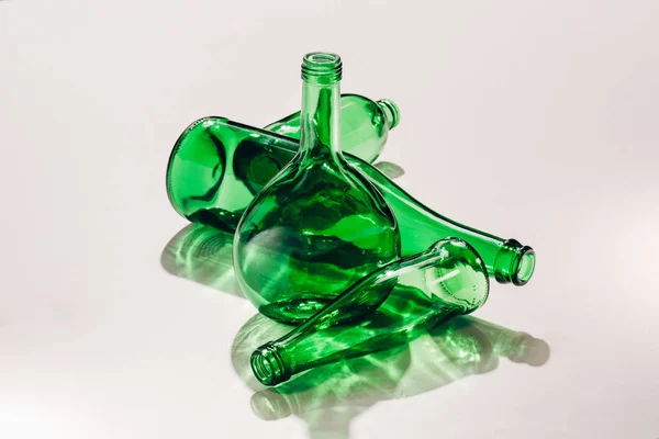 Close up view of empty green glassware on whit ebackdrop — Stock Photo