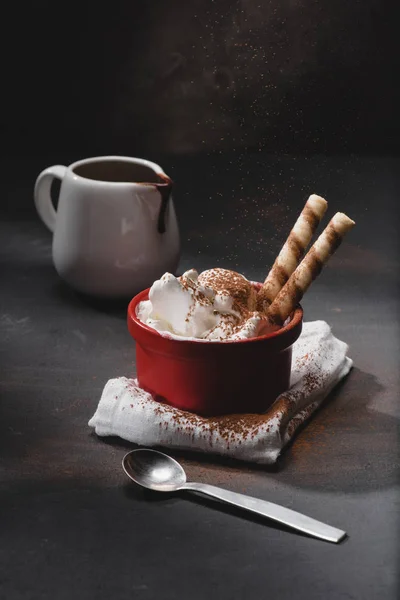 Delicious ice cream in bowl with waffles on table — Stock Photo