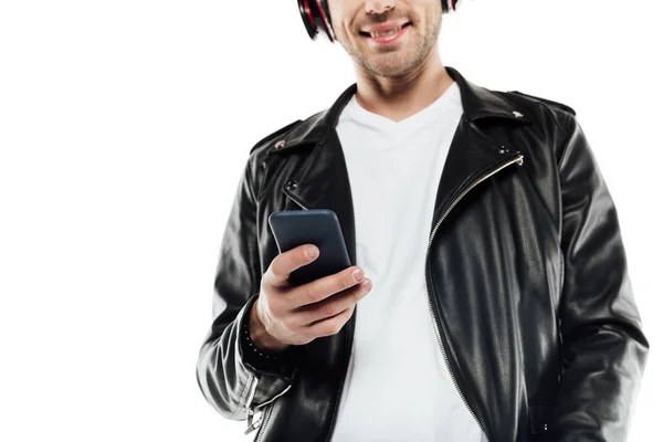 Fiatal férfi fejhallgató használ smartphone — Stock Fotó