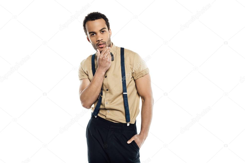 young man wearing suspenders