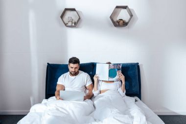 couple reading in bed clipart