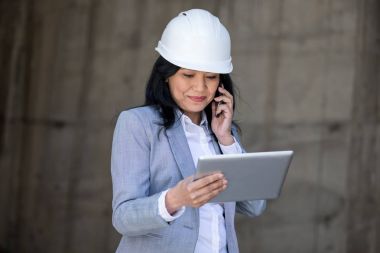 Businesswoman using smartphone clipart