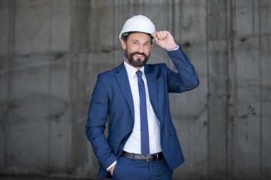 Middle aged businessman in hard hat