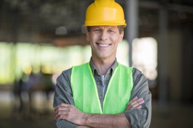 Mature builder in hard hat clipart