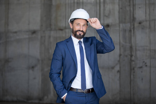 Middle aged businessman in hard hat