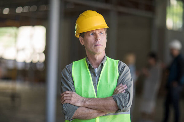 Mature builder in hard hat