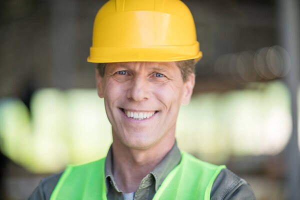 Mature builder in hard hat