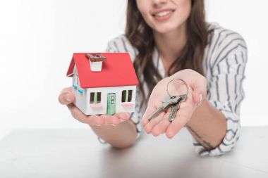 Young woman with house model  clipart