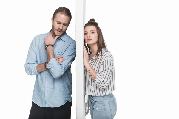 Young couple separated by wall — Stock Photo, Image