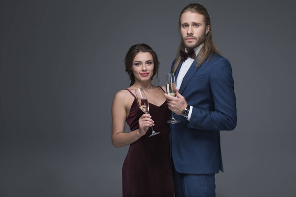 young couple in evening outfit with champagne