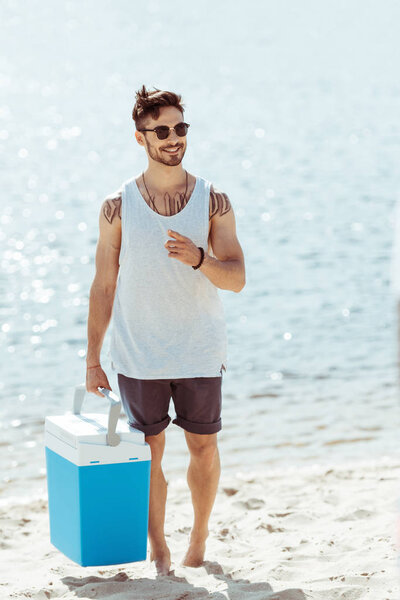 man holding cooler box