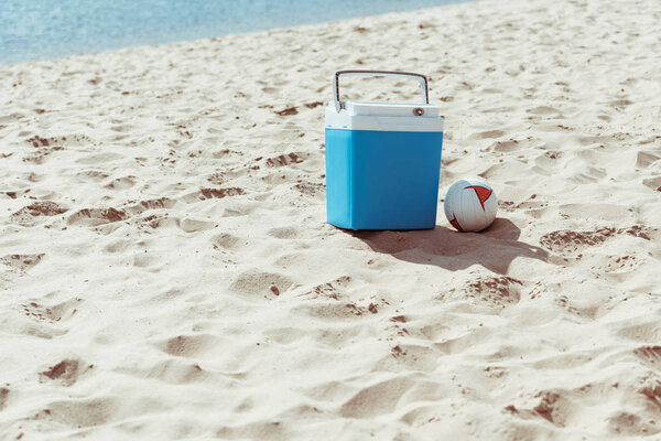 cooler box and volleyball ball