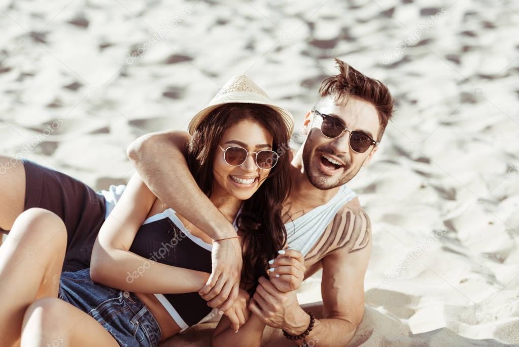 Happy young couple at beach 