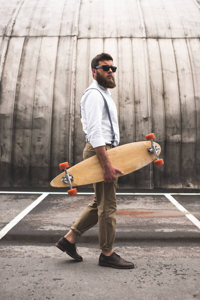 stylish man with longboard