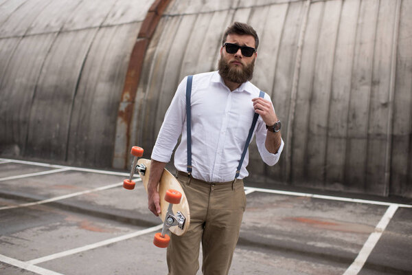 stylish man with longboard