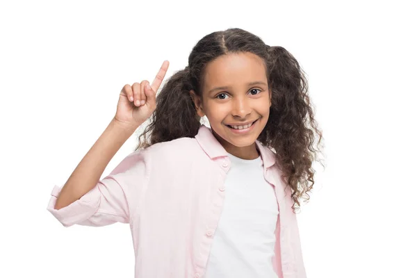 Girl pointing up with finger — Stock Photo, Image