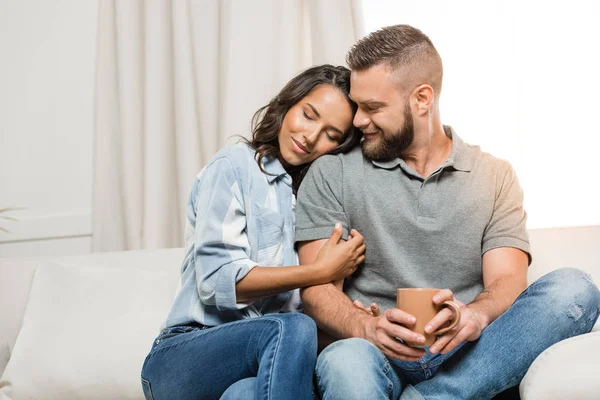 Happy couple hugging at home — Stock Photo, Image