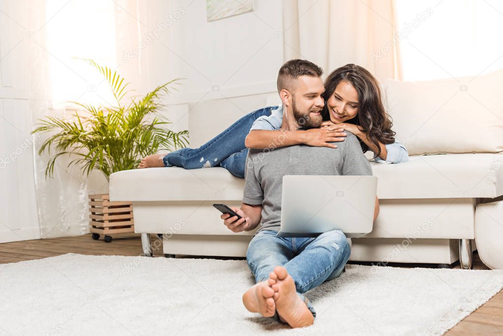 Couple using laptop 