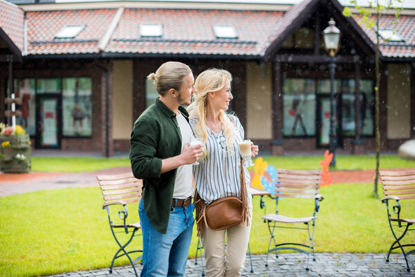 couple drinking coffee at park