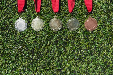 various medals on grass clipart