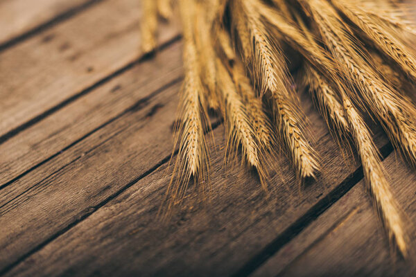 Ripe wheat on table