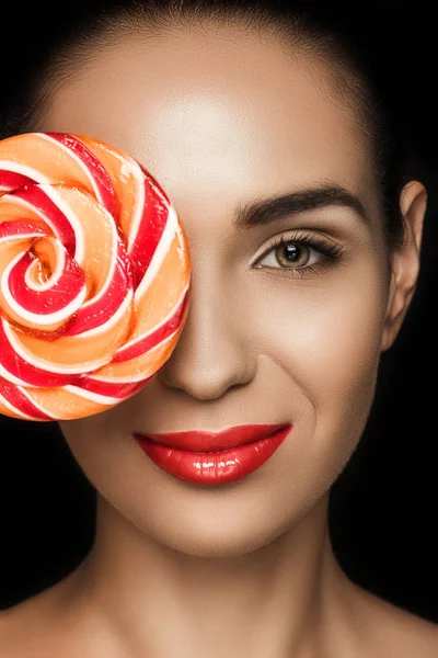 Beautiful woman with lollipop — Stock Photo, Image