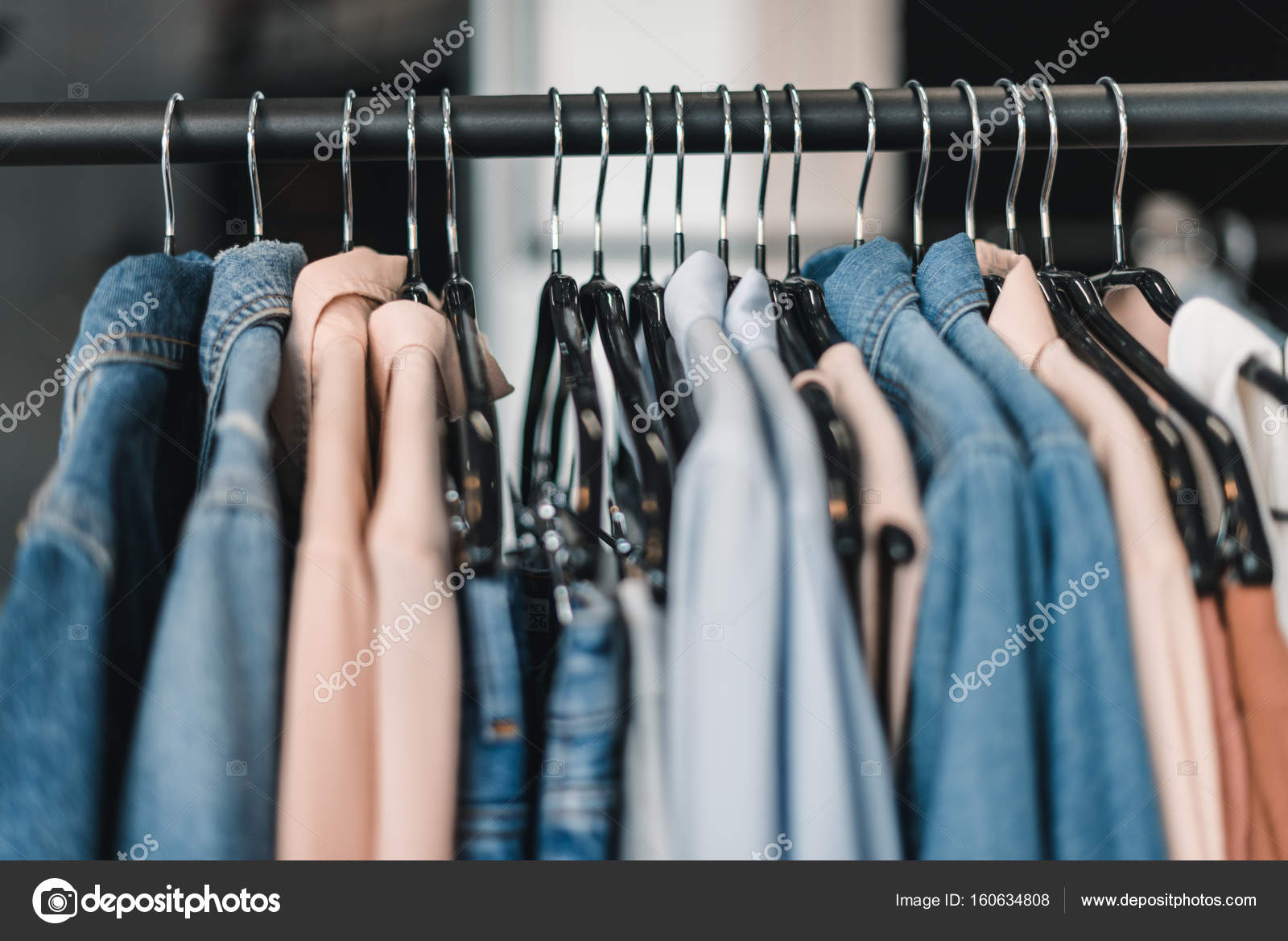 Stylish clothes on hangers Stock Photo by ©AllaSerebrina 160634808