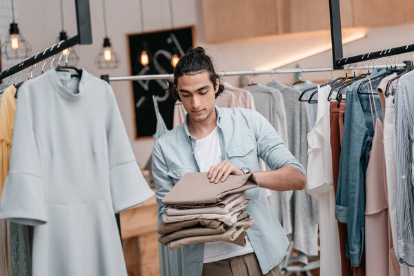 man working in boutique