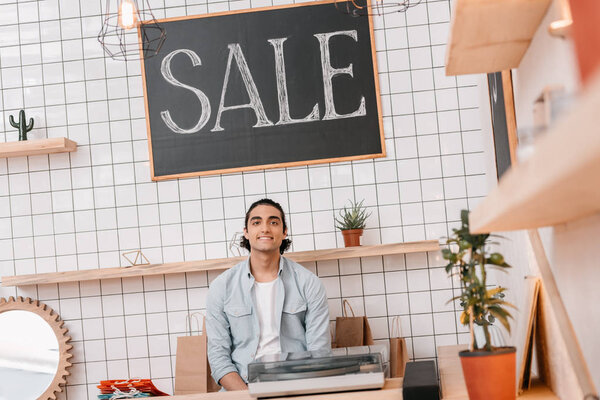 smiling young man in boutique