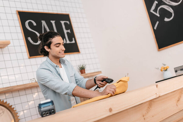 seller scanning clothing