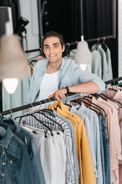 boutique owner with clothes