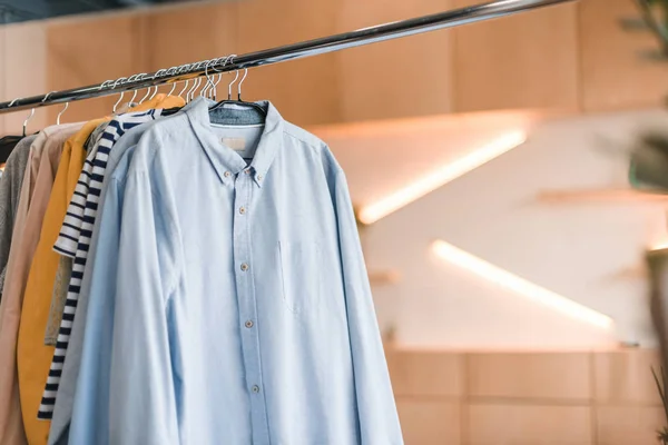 Stylish clothes on hangers — Stock Photo, Image