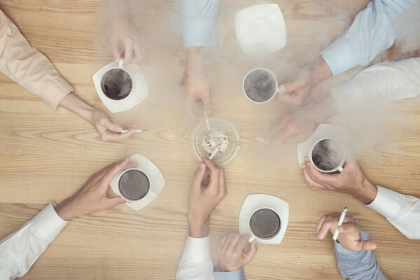 businesspeople smoking on coffee break