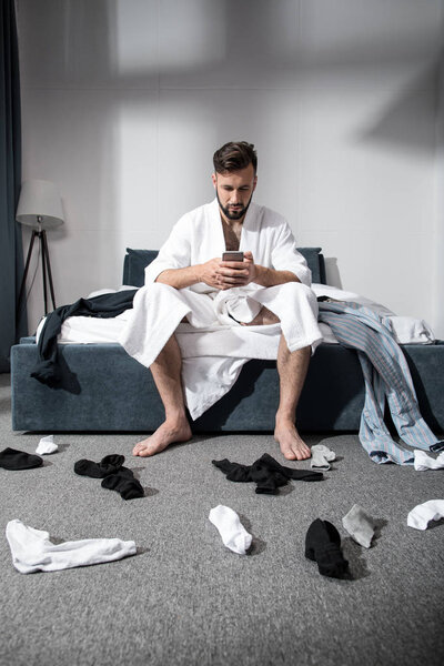 man using smartphone at morning