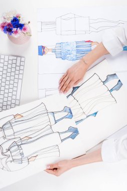 fashion designer working with sketches clipart