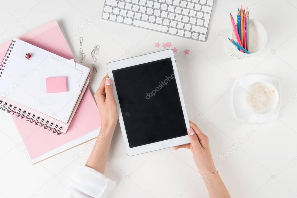 woman with digital tablet at workplace