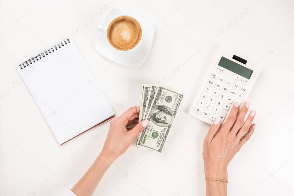 businesswoman and dollar banknotes at workplace    