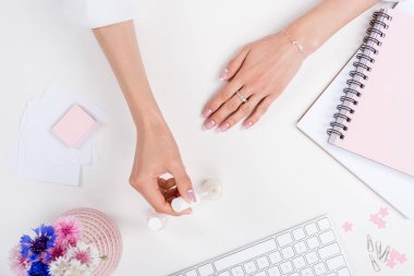 woman doing manicure at workplace  clipart
