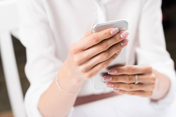 woman using smartphone