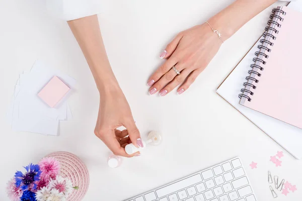 Woman doing manicure at workplace — Stock Photo, Image
