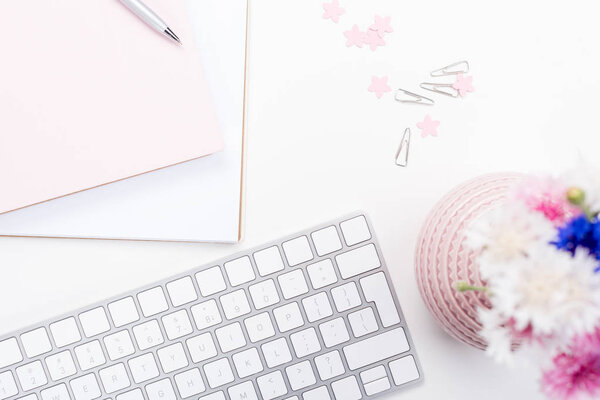 keyboard and office supplies with flowers