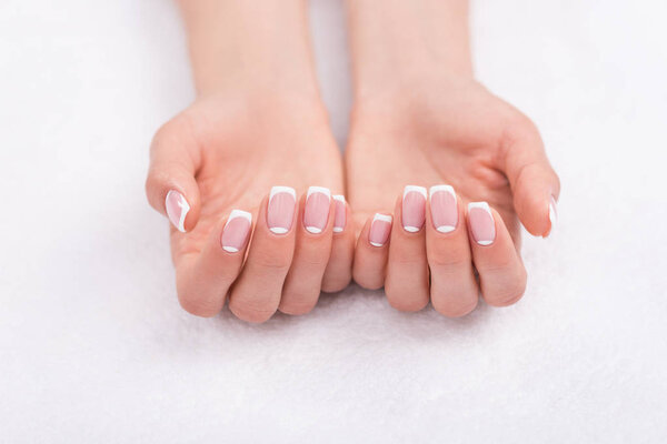 female hands with french manicure