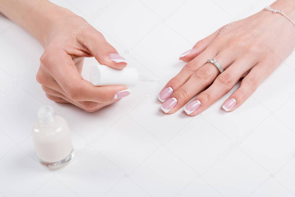 woman doing manicure