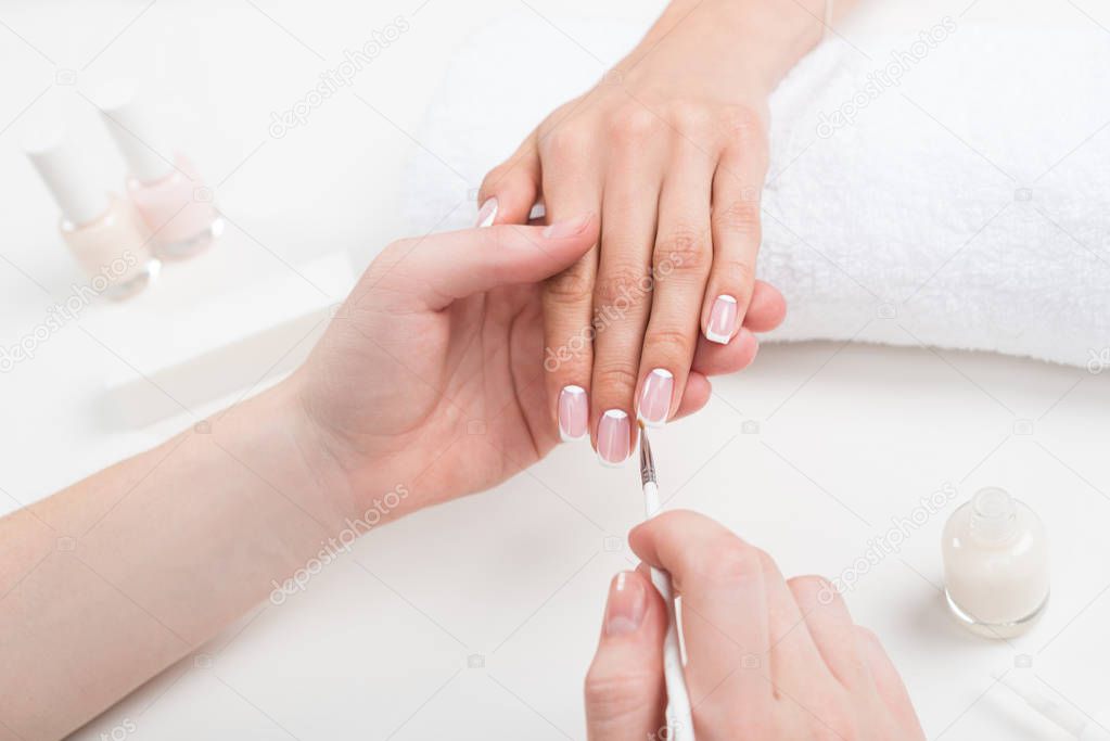 manicurist doing manicure