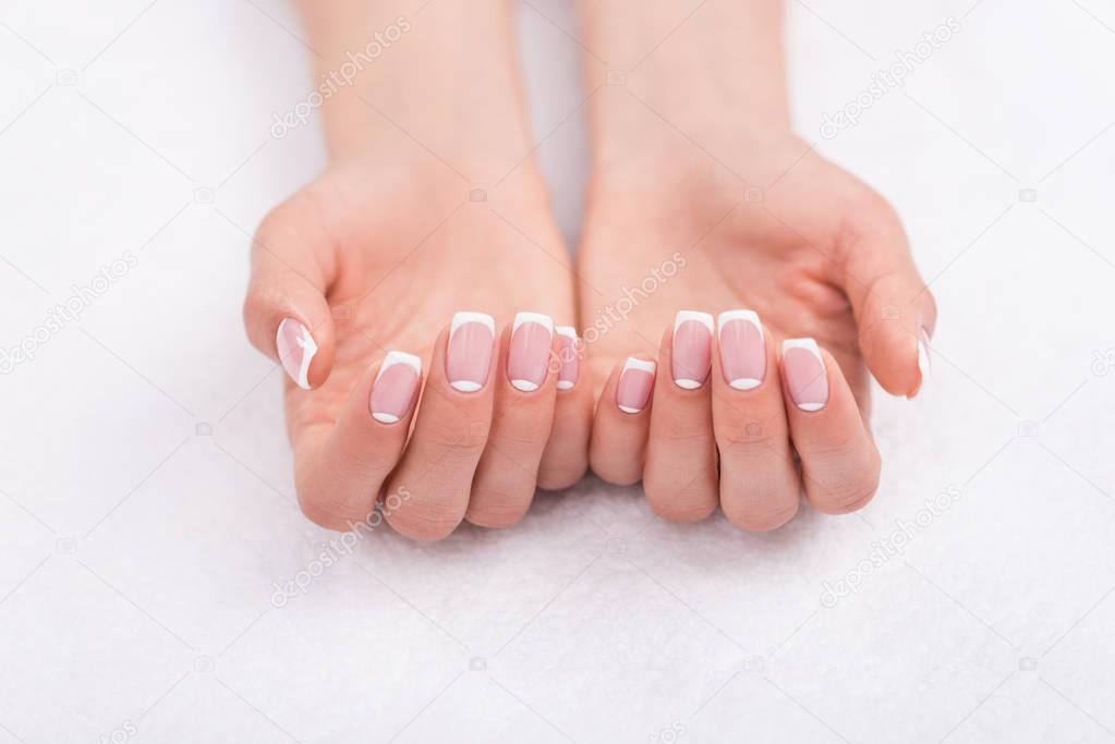 female hands with french manicure