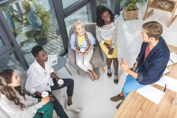 Multiethnic coworkers having coffee break — Stock Photo, Image